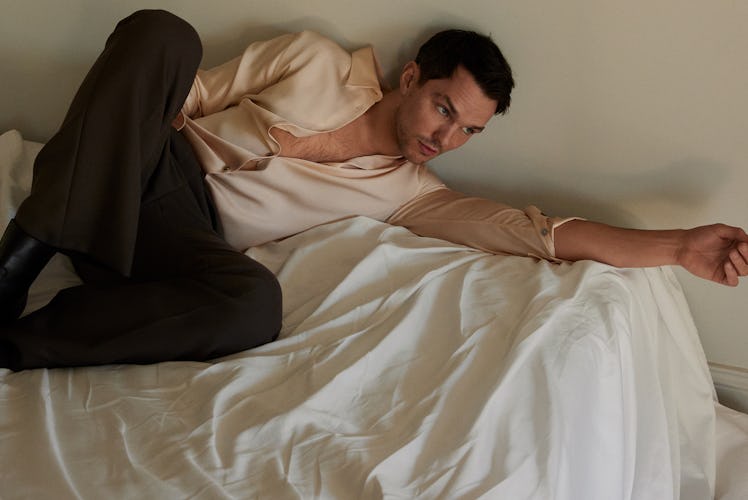 Nicholas Hoult wears a Louis Vuitton Men’s shirt and pants; stylist’s own boots.