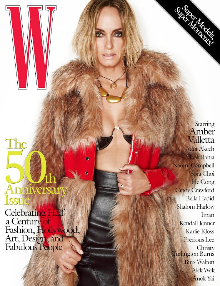 Amber Valletta wearing a Gucci coat, bra, and skirt