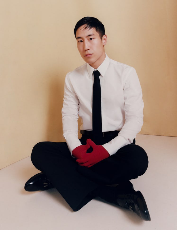 Mazino wears a Ferragamo shirt, tie, trousers, gloves, and shoes; Rebecca Turbow belt.