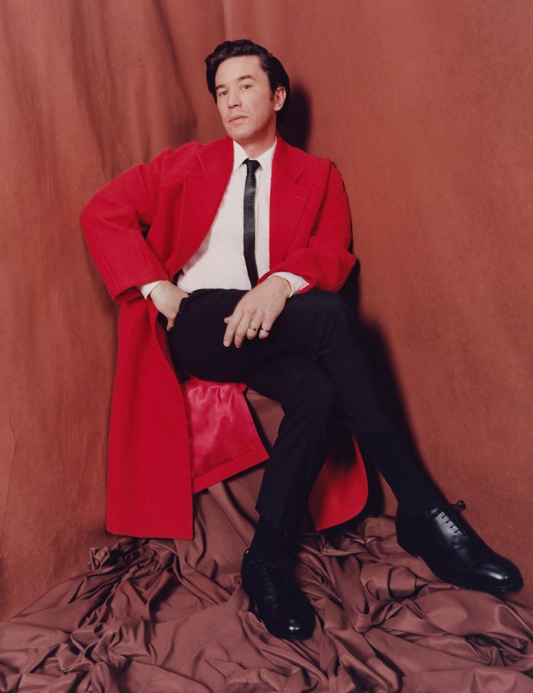 Pelphrey wears an Alexander McQueen coat, shirt, trousers, and tie; Church's shoes.