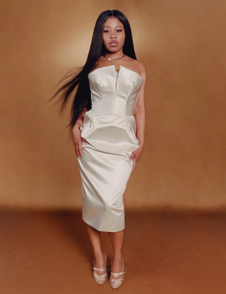 Fishback wears Maison Margiela dress and shoes; Van Cleef necklace.