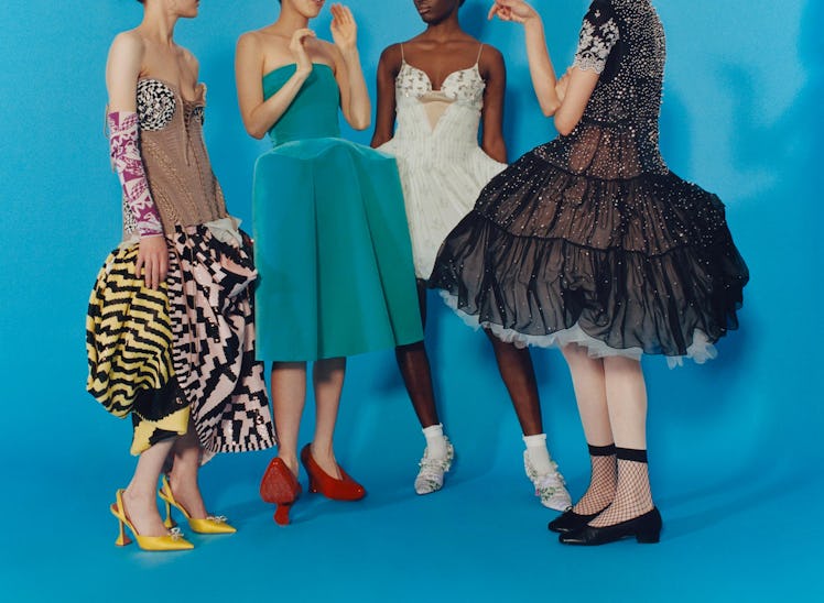 Stordiau wears a Matty Bovan x Dolce & Gabbana corset top, skirt, and sleeves; Amina Muaddi shoes. L...